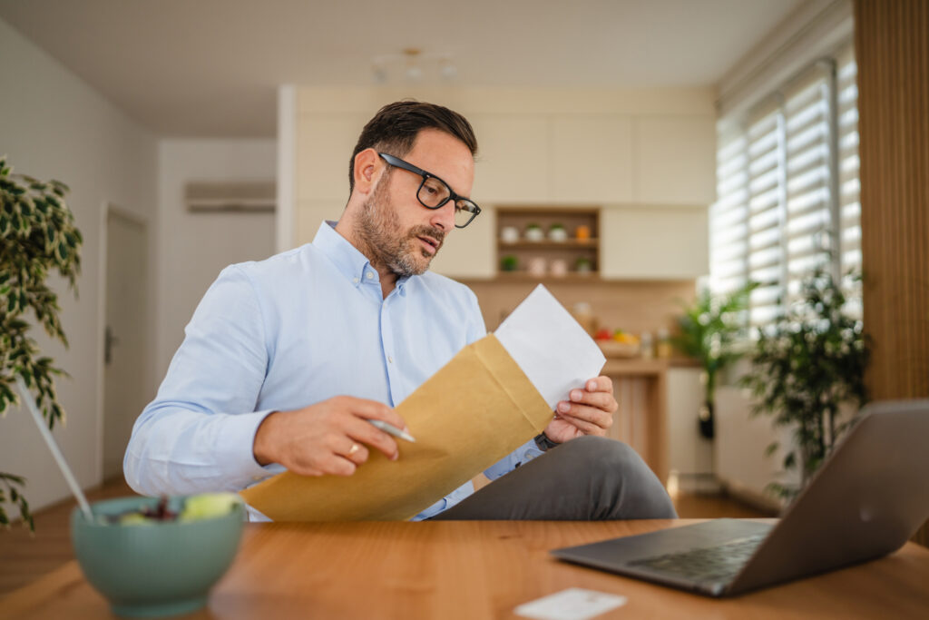 A process server delivers a summons to an entrepreneur working from his home office in Washington DC